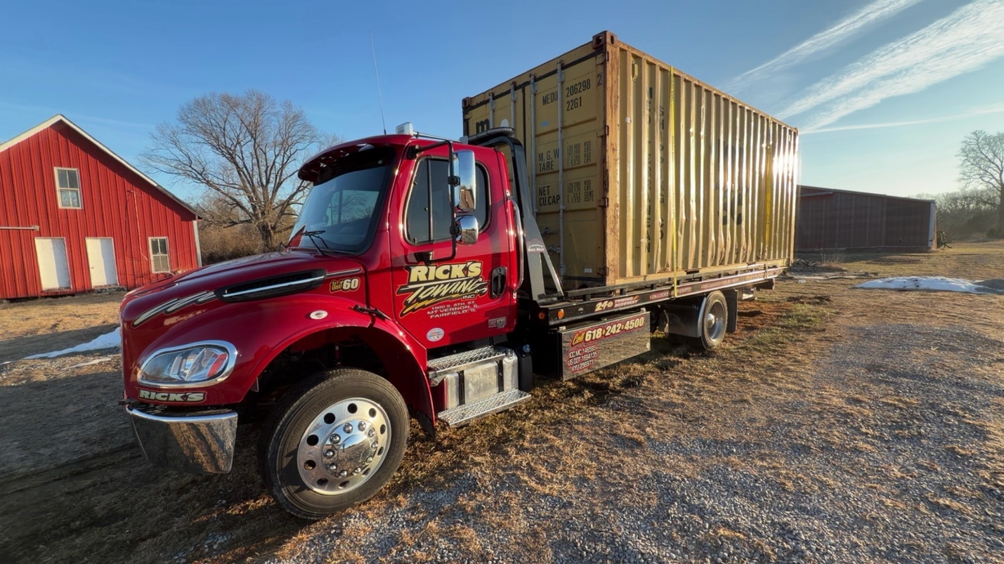 Rick's Towing flatbed on location