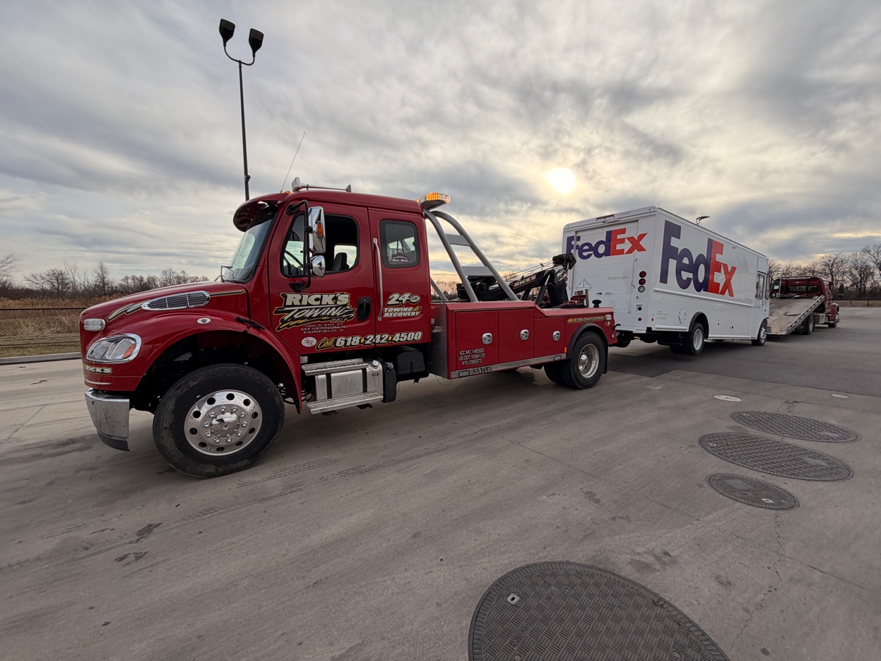 Rick's Towing medium duty — towing FedEx commercial vehicle