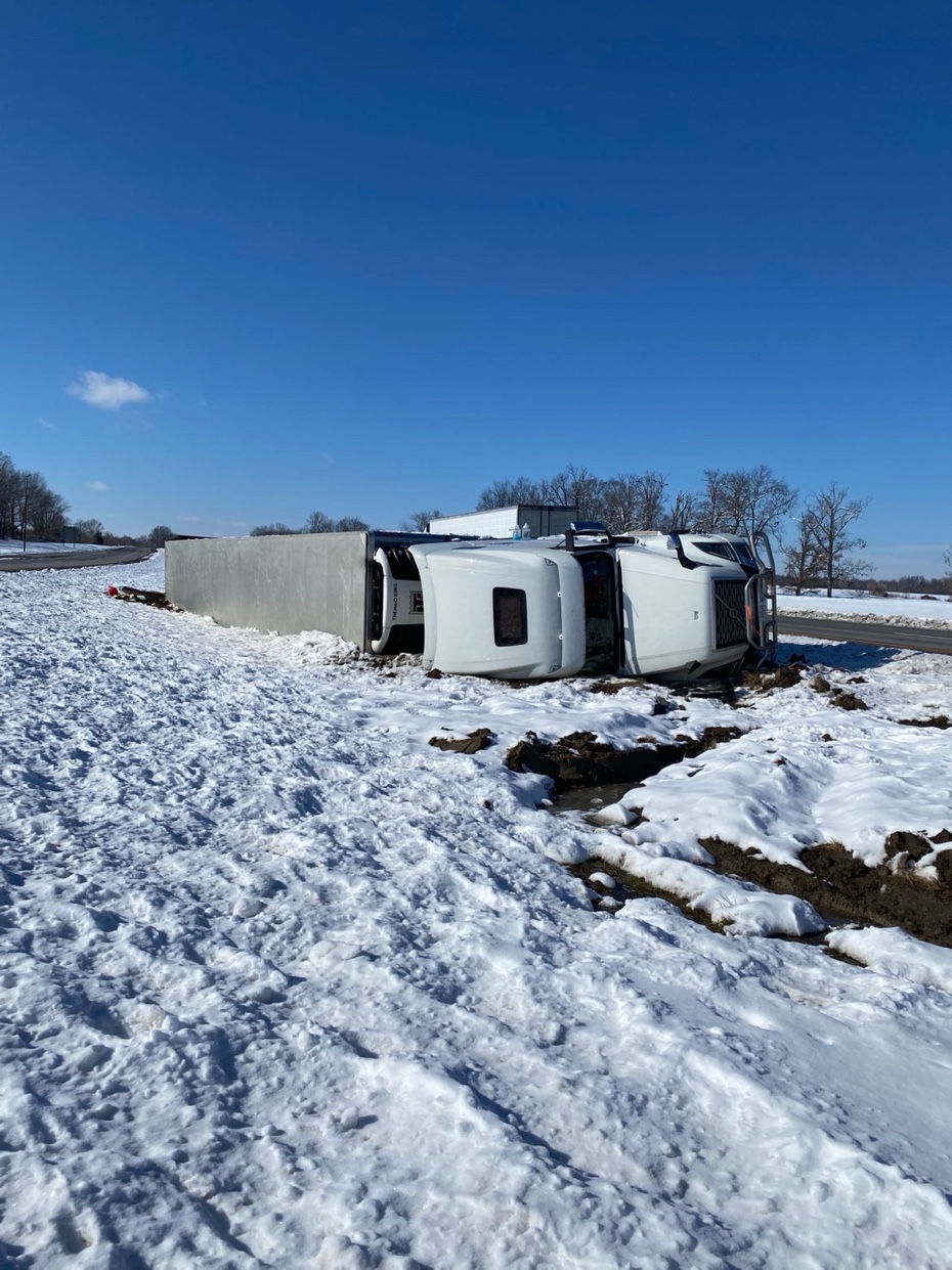Semi rollover accident recovery in winter
