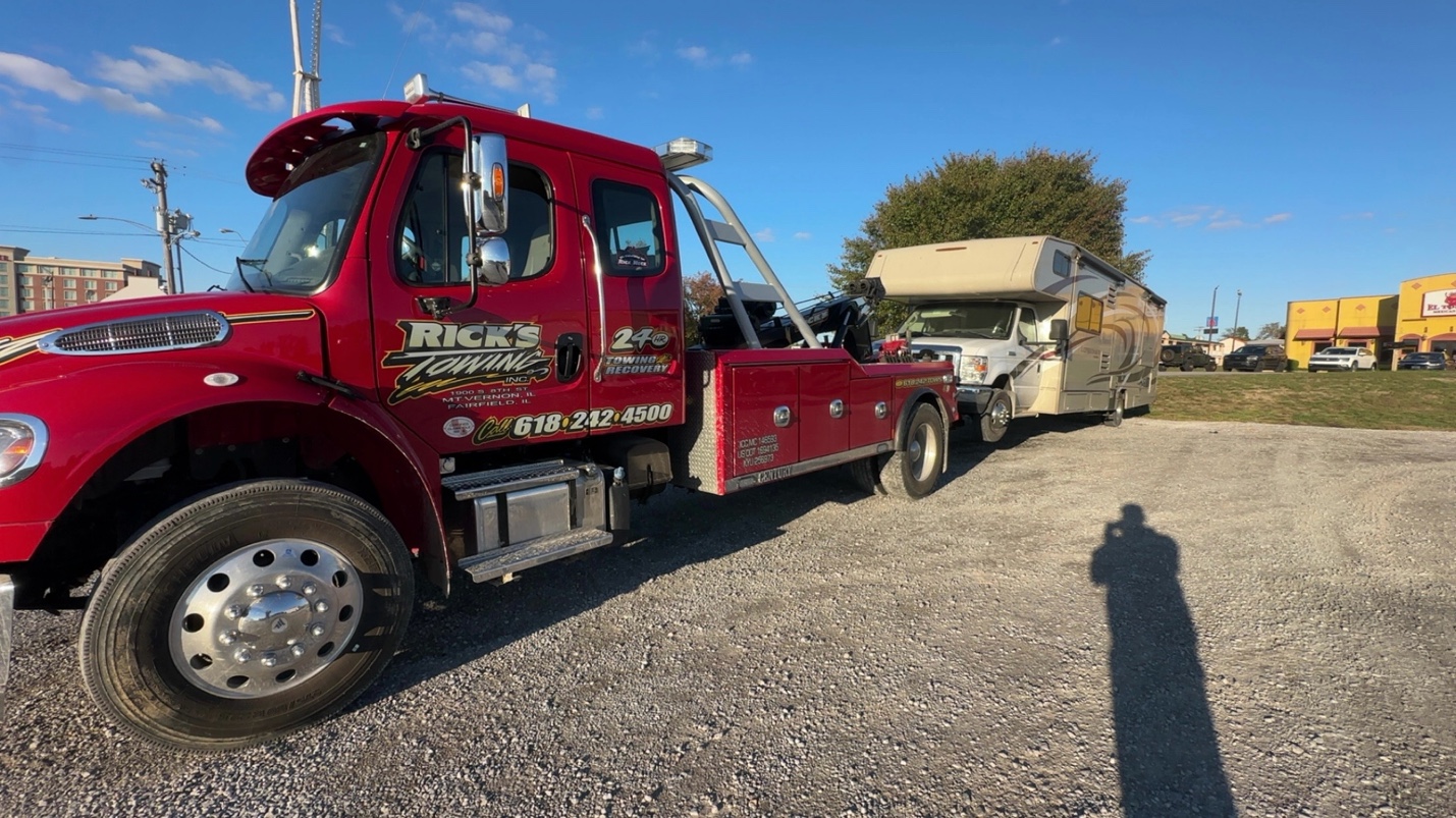 Rick's Towing light duty — tow truck with vehicle